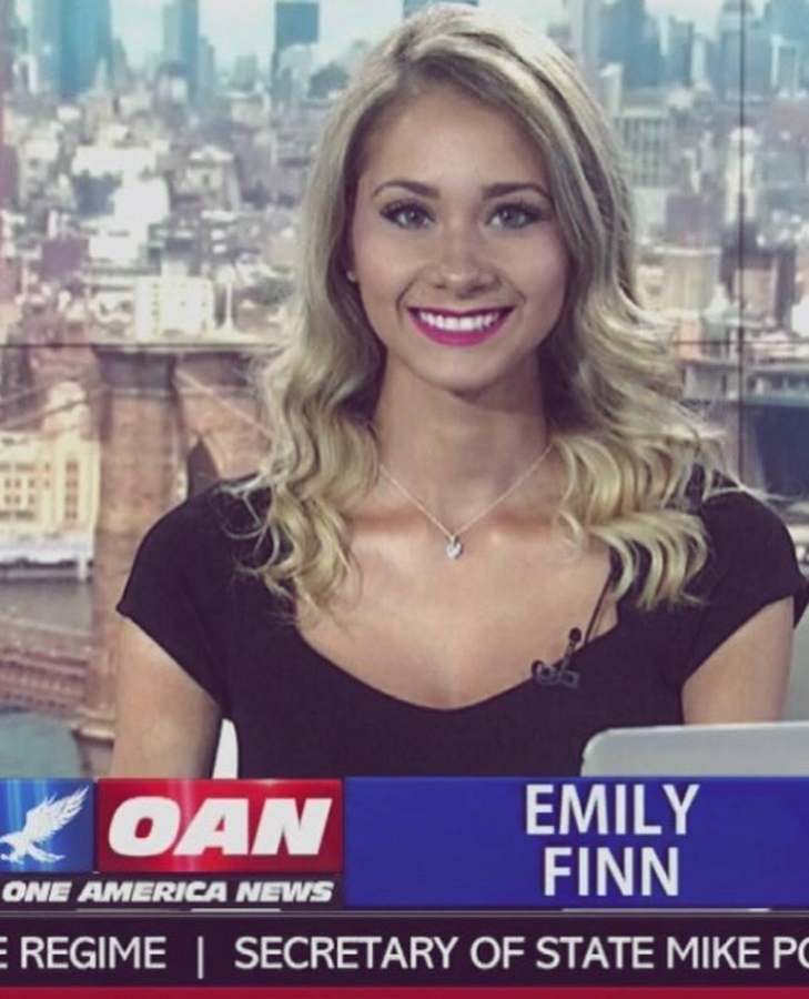 Emily reporting in the field with an OAN microphone