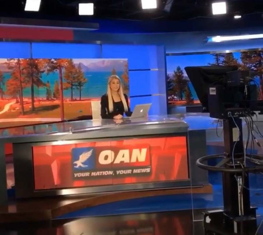 Emily at the OAN anchor desk
