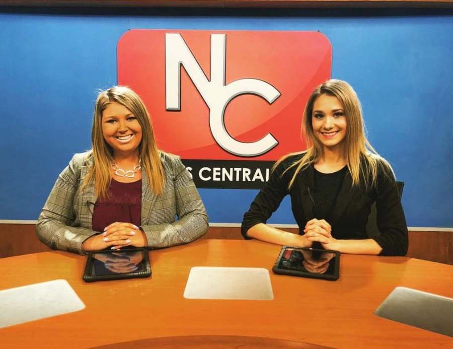 Emily co-anchoring at the NC34 desk