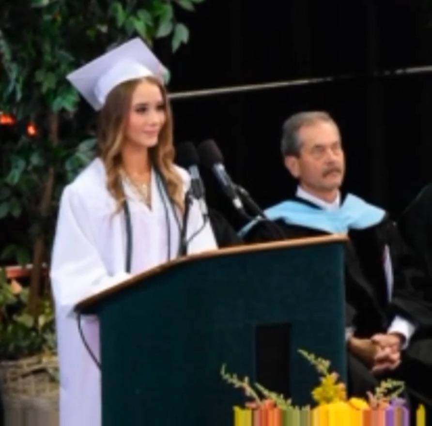 Emily speaking at her high school graduation